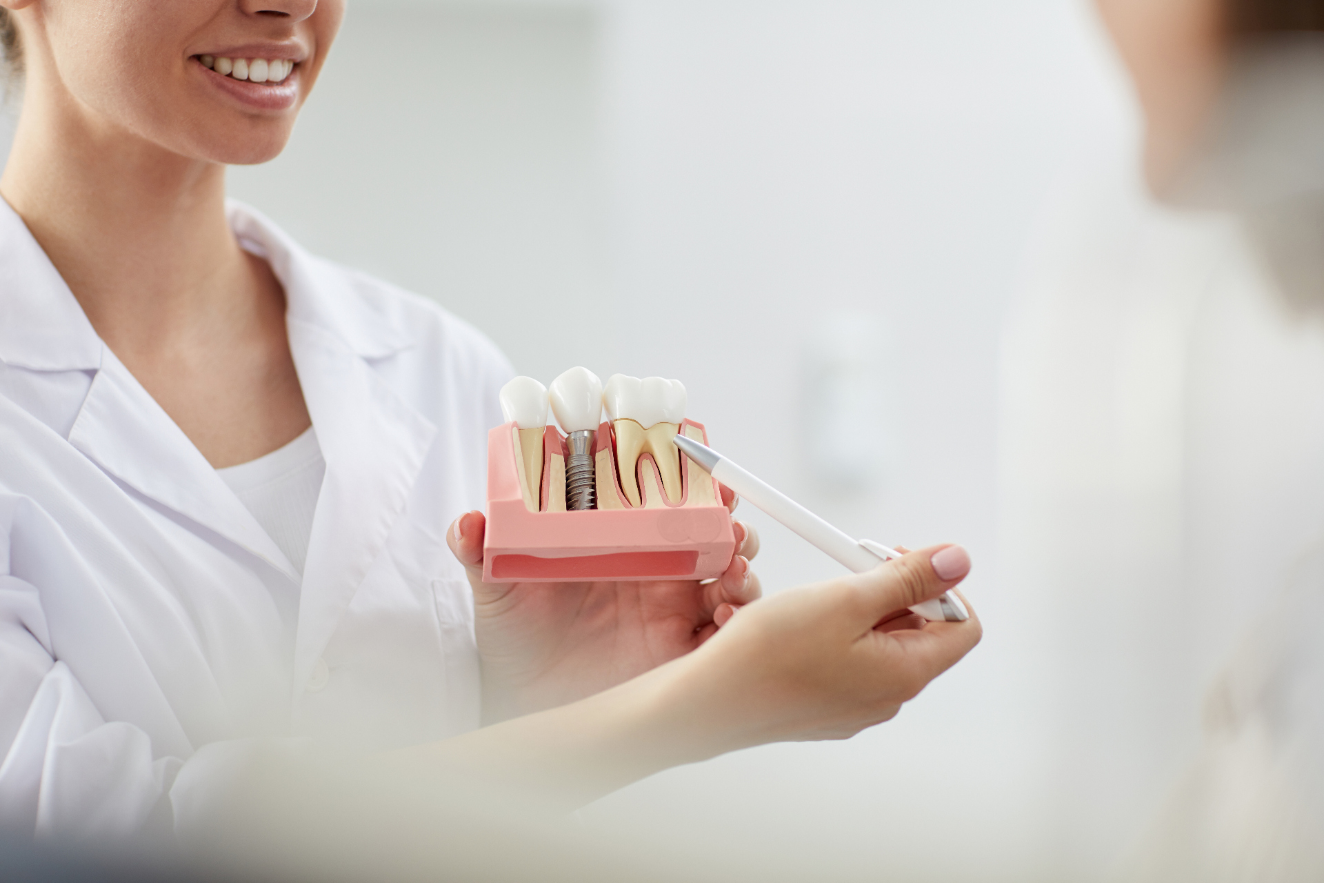 dental assistant showing peridontal disease